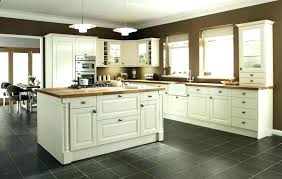 Cream kitchen cabinets with wood floors and white granite countertops. Kitchen Design Dark Floors Affect Kitchen