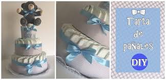 Enrolla un pañal, empezando por el extremo abierto. Como Hacer Una Tarta De Panales Para Baby Shower Manualidades On