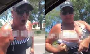 Woman flashes breasts