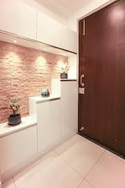 The Shoe Rack In The Foyer With Stone Cladding Modern Corridor Hallway Stairs By U And I Designs Modern Home Entrance Decor Hallway Designs Entrance Door Design