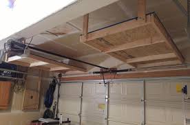 Suspended shelving might just be for you if you're planning to make use of every square foot of your garage. Above Garage Door Storage Project Diy Finished Garage Storage Shelves Garage Hanging Storage Garage Door Design