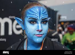 New York City, United States. 13th Oct, 2023. Makeup artist Madison Goode  shows off her handy work wearing makeup for a character from ''Avatar''  during New York Comic Con 2023 at the
