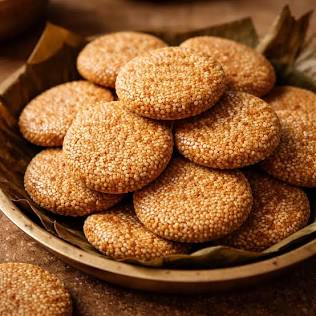 Hand-pounded Gaya Tilkut sweet discs, AI generated