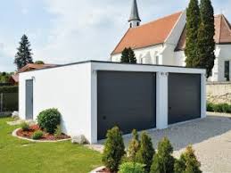 White Render Box Flat Dark Roof But With 2 X Wooden Effect Doors Side Door For Easy Access Plus Add On Car Port Garage Exterior Garage Design Carport Patio