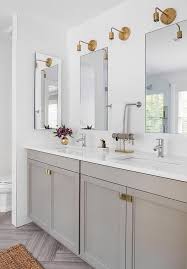 Pulled from the marble that appears throughout the space, soft grays and crisp whites make this neutral bathroom a relaxing retreat. 12 Bathrooms With Gray Cabinets That Will Melt Your Stress Away Hunker Bathroom Countertops Bathroom Redecorating Bathroom Design