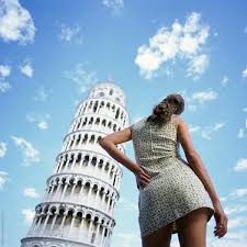 Piazza dei miracoli, the area around the cathedral and the tower, is beautiful, and a visit can easily. Woman Posing Infront Of Leaning Tower Of Pisa Italy By Hugh Sitton