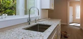 Another sophisticated kitchen countertop idea that works great for modern designed kitchens is this yellow and white themed countertop. White Granite Photos Ideas Products Hackrea