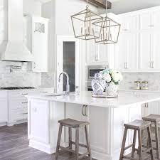 Stacked cabinets also add height to kitchen cabinets in a room with tall ceilings and they create interesting arrangements in any room in the home. Diy Stacked Kitchen Cabinets Frills And Drills