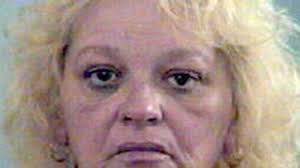 Lexington mother accused of locking child in cage, strangulation