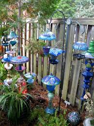 Whimsical Garden Lamps And Bird Feeders Love These Garden Art Diy Glass Garden Art Whimsical Garden