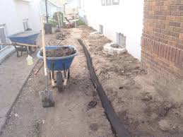 Installing a french drain will help prevent flooding and pooling in your yard. French Drain Installation Exterior Drain Tile Aaa Reick S