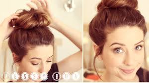 Twist the loose hair from the ponytail around the base of the ponytail to create a bun. How To Messy Bun Zoella Youtube