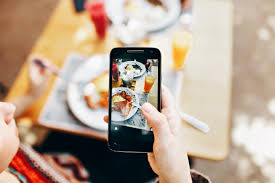 Maybe you would like to learn more about one of these? Person Holding Phone Taking Picture Of Served Food Free Stock Photo