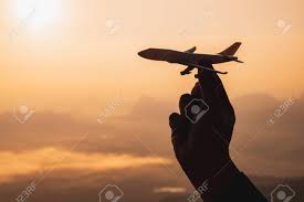 A Hand Holding A Toy Plane Go To The Sky With Sunset Light Stock Photo Picture And Royalty Free Image Image 140983440