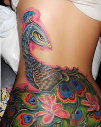 88 back tattoos that are bold, beautiful, exciting… if you're thinking about getting a back tattoo, you better check this piece, unlike most feather tattoos, depicts the tail feathers off a lovely peacock. Cover Up Peacock Tattoo Girl Back Tattoos Back Tattoo Women Peacock Tattoo