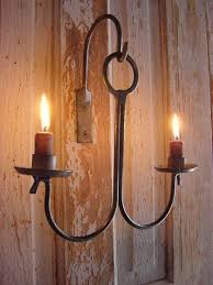 They're pretty enough to balance out other wall hangings in the living room or be displayed on their own creating the candlelit atmosphere on a patio. Rustic Sconce Candle Holder Candle Wall Hanging Blacksmith Etsy