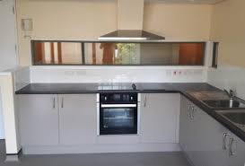 Open beams with rustic walls, feature grey high gloss kitchen with a range of wall and base units all with soft close and plinth lighting underneath, built in bosh double over and induction hob with. Premiere Kitchens Kitchens For Social And Affordable Housing Case Study Communcal Student Kitchens