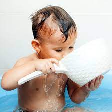 Kid splashing water in bath room. Water Intoxication In Babies Everything You Need To Know Parents