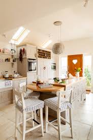 It features wood construction mixed with a country design, while also offering 2 functional leaves, 1 open shelf, and 4 straight legs with saber feet. Kitchen Island Extension Ideas Houzz