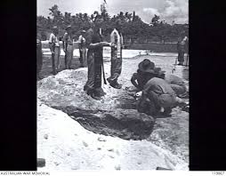 THE REINTERNMENT AT MOROTAI OF THE REMAINS OF TWO RAAF AIRMEN. FLIGHT  LIEUTENANT BERNARD NEWMAN ...