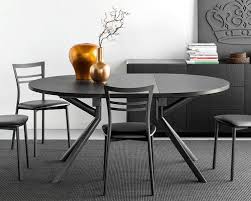 The curved legs have a solid metal core. 20 Expandable Tables You Ll Need For Social Gatherings 2modern