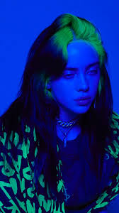 A wallpaper of billie eilish in a full yellow outfit on a yellow background and seated on a green chair. Billie Eilish Aesthetic Wallpaper Green 2021