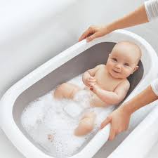 He doesn't fit into his baby tub anymore so we had to move him into the regular tub. Oxo Tot Splash Store Bathtub