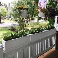 With the boxes you made, and made so easy for me to install, our. White Flower Boxes Sit On Top Of Porch Railings Deck Railing Planters Porch Flowers Railing Planters