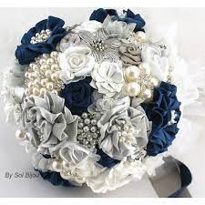 Brides love blue shades especially the navy blue color, which has been the top wedding color for several years. Brooch Bouquet Navy Blue White Gray Silver Wedding Jeweled Bridal 350 Liked On Polyvore Blue Wedding Bouquet Coral Bouquet Wedding Bridal Bouquet Blue