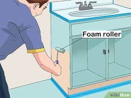 Give your bathroom cabinets one to two additional coats of paint over the base as needed to achieve the desired depth of color. How To Paint A Bathroom Vanity With Pictures Wikihow