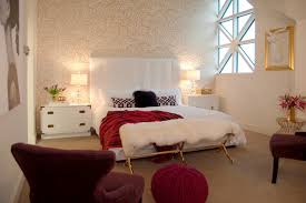 Minimalist bedroom decorating ideas the beautiful rug beneath the bed looks like eye candy, and the serene scenery on the wall adds a dash of classic to the whole setting. White Bedroom With Red Maroon And Gold Accents Hgtv