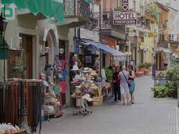 Italian markets are a treasure trove of fresh, seasonal fruit and vegetables, local cheese and cured meats, olives, plants/flowers, leather goods, shoes and clothes! Shops In Downtown Stresa June 2014 Stella Lucente Llc Www Learntravelitalian Com Cities In Italy Piedmont Region Europe Travel