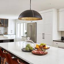 Though this kitchen's range and cabinets are both white, one has brass. Benjamin Moore Cloud White Design Ideas