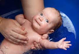 Dip the washcloth in warm water and wash your little one's neck and torso. Guidelines For Bathing Your Newborn Drgreene Com