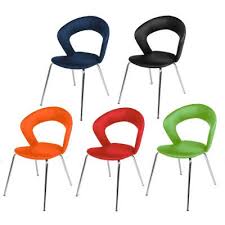 The Actona Edna Dining Chair Has A Modern Open Back Design Faux Leather Seats Available In A Range Of Bold Colours Chairs Ju Leather Seat Dining Chairs Chair