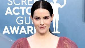 Emily Hampshire Reflects On Investing In Therapy After Heartbreak