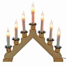 With candle holders like these, you can make the most of a flickering candle's romantic light and old world character. New Christmas Lights Electric Pine 7 Bulb Flickering Wooden Arch Candle Bridge Window Decoration Candlebridge X Mas Gift Buy Online In Maldives At Maldives Desertcart Com Productid 52170278