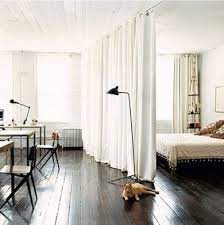 Divide And Conquer 10 Room Dividers To Bring Order To Your Space Apartment Living Small Spaces Room Divider Curtain