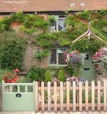 English Country Garden Pottery Cottage In Oxfordshire The Tiny Front Garden With Hanging Ba Country Cottage Garden Country Garden Design Cottage Front Garden