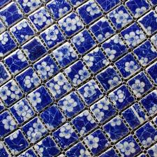 This white bathroom is broken up with an entire wall of blue glass tiles arranged in clean lines to help create feelings of calmness. Blue And White Porcelain Mosaic Backsplash Glossy Ceramic Fifyh Com