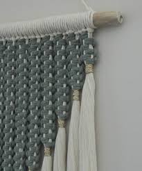 You can find macrame plant hangers in different colors and accented with wooden beads, or you can make your own. Large Macrame Wall Hanging Made To Order Sage Green Natural Modern Boho Fiber Art Decor With Gold Yarn Birthday Mothers Day Gift For Her Macrame Wall Hanging Macrame Patterns Macrame Patterns
