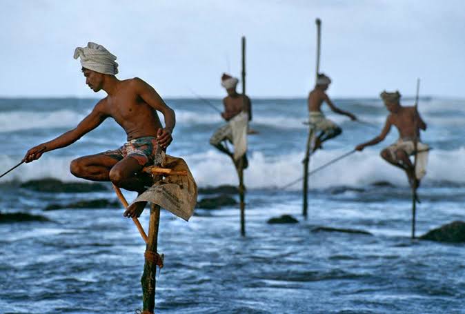 Ahangama stilt fishermen traditional poles Indian Ocean golden morning light silhouette photography Coconuts surf break south coast Sri Lanka