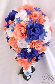 Such as girls in coral bridesmaid dresses and holding coral bouquets, groom and best men wear navy blue suits, water. 27 Coral Royal Blue Gold Wedding Ideas Wedding Blue Gold Wedding Wedding Colors