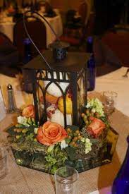 I Like The Mirror Under The Lantern Would Put Over Tulle Rather Than Burlap Lantern Centerpieces Lantern Centerpiece Wedding Wedding Lanterns