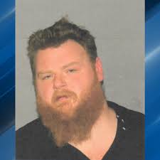 Man faces DUI charge after allegedly driving past closed road, crashing  into downed wires