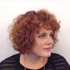 It features a short fringe in the front and a high fade on the sides. 40 Cute Styles Featuring Curly Hair With Bangs