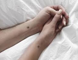 Crucifixon christian tattoos as faith and heritage. Small Matching Tattoos For Couples