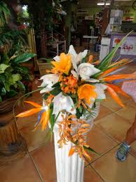 Cascading Tropical Bridal Bouquet Of Birds Of Paradise Cymbidium Orchids And Mokara Orchids Floral Designs By Tropical Bridal Bouquet Florist Bridal Bouquet
