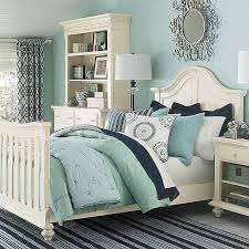 Mint and pastel blue lamps above small table and wooden chairs for kids. Great Cottage Guest Bedroom Guest Bedroom Inspiration Guest Bedrooms Bedroom Colors