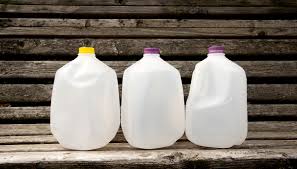 When you water the top bottle, water will drip down to all others. How To Upcycle Plastic Milk Jugs Hello Homestead